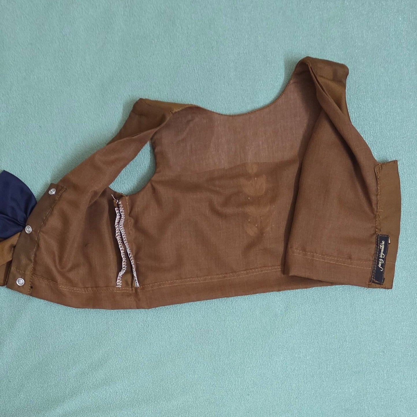 Brown jacket on a light blue background