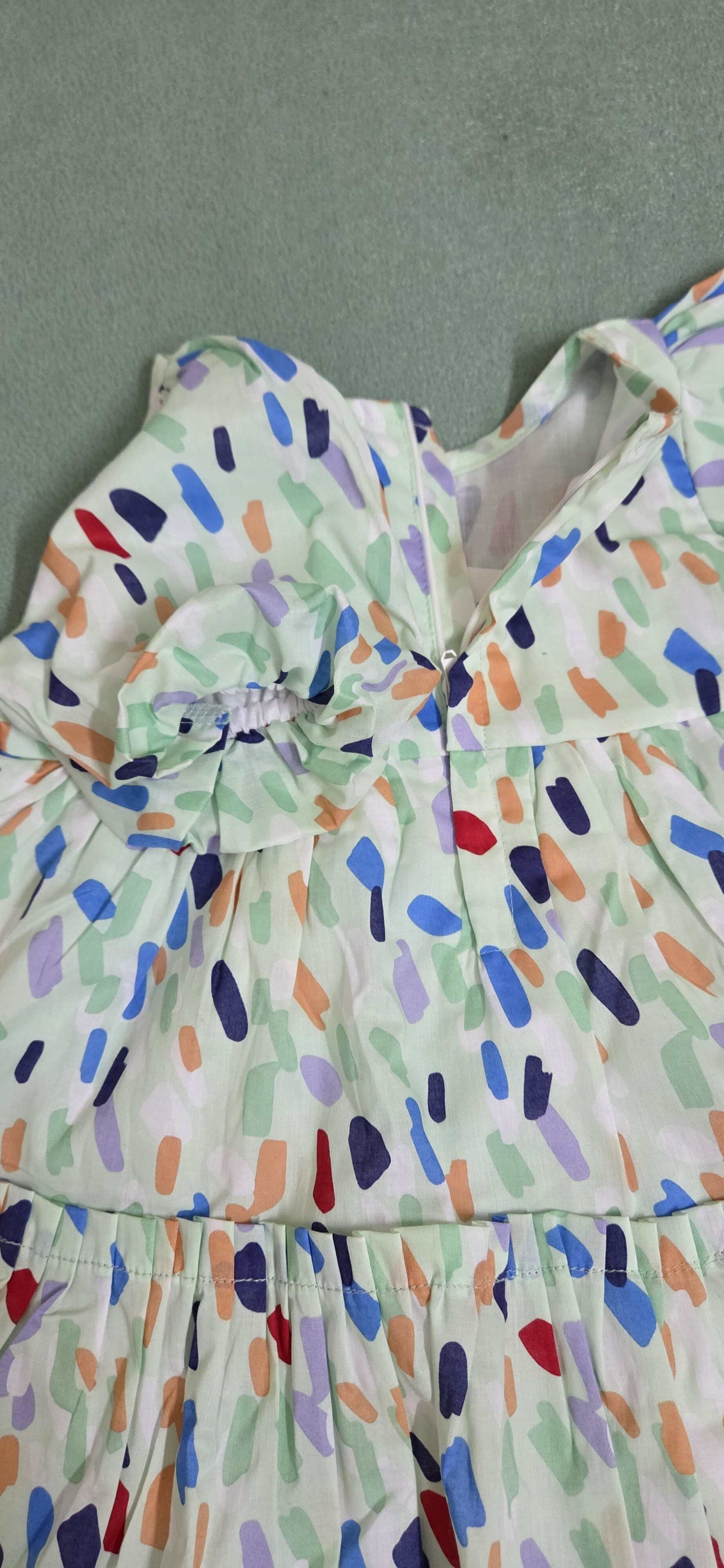 Colorful dress with abstract pattern sleeve close-up