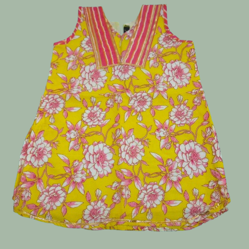 Yellow dress with pink floral pattern on a light green background