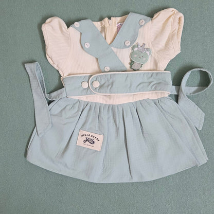 Light blue dress with white shirt and bear design on a gray background