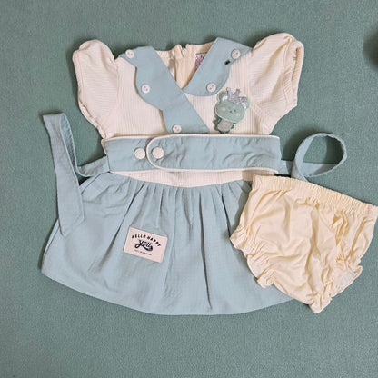 Baby outfit with light blue dress and bloomers on a gray background